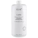 Frasco branco de 1000 ml da linha Care da Keune, com rótulo destacando o "Derma Exfoliate Shampoo" para cabelos e couro cabeludo anti-caspa.