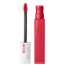 Tubo rosa vibrante com o nome da marca "Maybelline New York" impresso. Ao lado, um aplicador preto com uma ponta esponjosa em formato de lágrima.