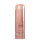 Frasco rosa de shampoo da marca Braé, chamado "Revival", com informações sobre reconstrução imediata para cabelos extremamente danificados.