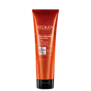 Tubo de creme para cabelos da marca Redken, com design vermelho e preto. Rótulo indica que o produto é da linha "Frizz Dismiss Rebel Tame" e promete controle de frizz com proteção térmica de até 230°C.