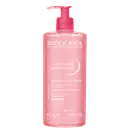 Frasco de gel de limpeza facial Sensibio da Bioderma, com 525g, embalagem rosa com bomba doseadora e rótulo com nome da marca e produto.