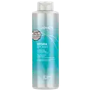 Frasco de condicionador hidratante da marca Joico, com textura fluida e tonalidade azul degradê, rotulado como "Hydra Splash Hydrating Conditioner" para cabelos finos a médios.