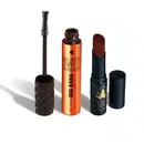 Máscara de cílios Big Bang 360 em embalagem laranja metalizada com tampa e aplicador na cor preta, acompanhada de um balm labial na cor marrom em embalagem preta com detalhe dourado, ambos da marca Quem Disse, Berenice?.