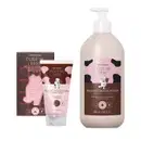 Três produtos da marca Cuide-se Bem Chocolatudo nas cores marrom, rosa e preto com ilustração de vaquinha, contendo sabonete em barra de 120g, bisnaga de 150ml de esfoliante corporal e frasco de 400ml de loção hidratante corporal.
