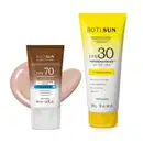 Dois produtos de proteção solar da marca Boti Sun: um frasco de protetor solar facial FPS 70 Cor 01 em bisnaga marrom e branca e uma frasco de protetor solar corporal FPS 30 em bisnaga amarela e branca com tampa amarela.