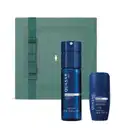 Imagem de um kit de produtos da marca Quasar Blue, incluindo um frasco de body spray azul e um desodorante roll-on azul, apresentados em uma caixa verde com detalhe dourado.