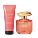 Imagem de dois produtos Coffee Woman Unique, sendo um vidro de 100ml com tampa dourada de desodorante colônia e uma bisnaga de tampa preta trazendo 200ml de loção corporal. As embalagens são na cor rosa com letras douradas. 