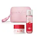 Imagem de um kit contendo três produtos da linha Cuide-se Bem Cereja De Fases, sendo um body splash em embalagem transparente, conteúdo rosa e válvula spray, um creme relaxante corporal em pote rosa claro e escuro e uma nécessaire rosa. Lindo e delicado.