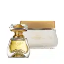 A imagem apresenta um elegante frasco da fragrância Elysée Blanc com borrifador dourado e tampa de cristal em formato de diamante, acompanhado de um pote de creme corporal de 250g da mesma linha, em embalagem de vidro transparente e tampa dourada.