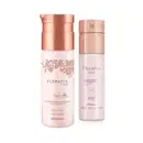 A imagem apresente dois itens da marca Floratta Rose: um frasco de creme corporal 200ml e um frasco de body splash 100ml. As embalagens são de plástico branco, tampas douradas e informações em letras na cor amarela.