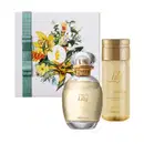 Kit contendo caixa com ilustração floral, desodorante colônia da marca Lily em vidro oval, borrifador e rótulo dourados e tampa transparente e um frasco de óleo corporal da mesma marca com embalagem transparente, tampa e informações douradas.