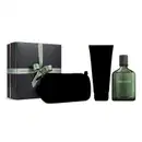 Caixa de presente cinza chumbo com laço verde em cruz. Ao lado, um frasco de item de perfumaria verde da linha Boticollection Horizonte e dois itens misteriosos, dos quais só se vê a silhueta preta.
