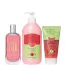 Conjunto de três produtos Egeo Melancia: perfume em frasco de vidro rosa com tampa prateada, loção hidratante em frasco pump rosa de 400ml e gel esfoliante em tubo verde e rosa de 150g, todos com rótulos vermelhos e verdes.