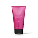 Bisnaga rosa com tampa preta e rótulo com os dizeres "Coffee Woman Seduction" em letras douradas. Recipiente contém loção hidratante desodorante corporal. Embalagem indica 30h de hidratação.