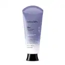 Bisnaga em degradê de lilás e branco com tampa preta e letras brancas e pretas contendo 180ml de loção renovadora hidratante corporal Nativa SPA Lilac.