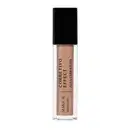 O produto de beleza é um corretivo líquido da marca Make B., em embalagem preta com rótulo branco, contendo a descrição "Corretivo Effect Alta Cobertura". O frasco é transparente, permitindo visualizar a tonalidade bege do produto.