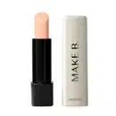 O produto exibido na imagem é um balm labial noturno da marca Make B. Lip Chronology Night Plump. A embalagem é composta por um tubo preto com uma tampa branca. O produto em si possui uma cor bege clara e suave.
