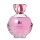 Vidro arredondado com líquido rosa, letras vinho, borrifador dourado e tampa transparente contendo 100ml de desodorante colônia Liz Flora.