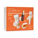 Kit de rotina da marca Botik Vitamina C contendo gel de limpeza, sérum, creme hidratante e protetor solar com FPS 50. A embalagem é laranja e branca, com informações sobre os benefícios dos produtos.
