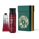 Conjunto de produtos Nativa SPA, incluindo um frasco de creme corporal "Cereja Rouge" em vermelho e uma caixa verde com detalhes dourados, exibindo uma ilustração floral.