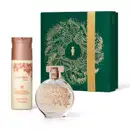 Frasco de vidro de desodorante colônia Floratta Gold arredondado e transparente, com flores douradas gravadas em relevo Ao lado um frasco branco com tampa dourada de body splash da mesma linha e uma caixa preenteável verde com ilustração natalina.