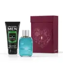 Caixa de presente de cor vinho com um grande coração contendo ilustrações em relevo de temática celestial. Ao lado, um item de perfumaria azul-turquesa com tampa prateada com a palavra CELEBRE em relevo no vidro, e uma bisnaga preta de creme da linha MEN.