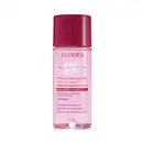 Frasco plástico transparente contendo líquido rosado. Tampa protetora na cor vinho. Embalagem com cores rosa e vinho, típicas da linha. Rótulo transparente com texto em rosa pink, quase vermelhor, e alaranjado. Nome da marca Niina Secrets em branco.