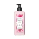 Creme hidratante desodorante corporal da linha Instance de Eudora. A embalagem é um frasco plástico rosa claro com um rótulo branco destacando o nome "Rosa Absoluta" e informações sobre o produto. O frasco possui um dispensador preto na parte superior.