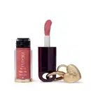 O produto de beleza Eudora Make apresenta um batom líquido rosa em embalagem cilíndrica, acompanhado de um espelho compacto dourado em formato de coração.