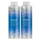 Dois frascos de produtos Joico da linha Moisture Recovery, um de shampoo e outro de condicionador, com embalagens em tons de azul e branco, rótulos com o nome da marca e informações sobre os produtos.
