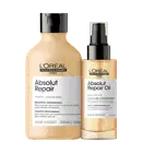 Um frasco de shampoo Absolut Repair e um frasco de óleo Absolut Repair Oil. O shampoo tem embalagem plástica transparente com rótulo preto e branco. O óleo tem embalagem plástica transparente com rótulo dourado e preto.