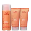 A imagem mostra o Kit Wella Nutri-Enrich com duas máscaras de 30ml e um shampoo de 50ml. As embalagens apresentam o logotipo da marca Wella com perfil estilizado de uma mulher com cabelos esvoaçantes e as cores predominantes são laranja e branco.