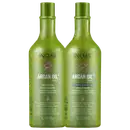 São dois frascos de plástico verde brilhante de 1 litro cada, com tampas verdes. Os frascos têm um design texturizado com um padrão geométrico em relevo. O rótulo indica que são produtos da linha Argan Oil System da marca Inoar.