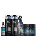 A imagem mostra um kit de TRUSS, contendo um shampoo e condicionador da linha Ultra Hydration Plus, um frasco de óleo capilar, um frasco do Uso Obrigatório Blond e um pote de máscara capilar net mask.