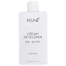 Frasco branco da marca Keune, contendo Cream Developer com 12% - 40 VOL. O rótulo apresenta o nome da marca e do produto em letras pretas.