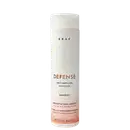 Frasco branco cilíndrico da marca Braé, contendo 250 ml de shampoo "Defense Anti Hair Loss Antiqueda" para promover o crescimento capilar.