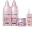 A imagem mostra shampoo e condicionador, 2 frascos rosa, máscara capilar pote rosa arredondado e spray 2 em 1 rosa.