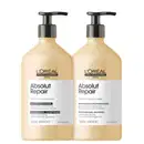 Shampoo e condicionador da linha Absolut Repair da L'Oréal Professionnel, com embalagens de plástico bege e detalhes em preto, contendo informações sobre os ingredientes e benefícios do produto.