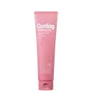 Tubo rosa com rótulo "Curling Essence 2X" da marca Mise en Scène, contendo um produto para cabelos cacheados com propriedades de fixação, hidratação e brilho.