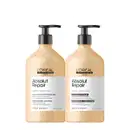 A imagem mostra dois frascos de plástico de produtos para cabelos secos e danificados da linha Serie Expert da L'Oréal Professionnel. Os frascos têm formato cilíndrico e cor bege, com bombas dosadoras pretas no topo.