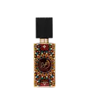 Frasco de perfume Lattafa Ajwad, com design colorido e geométrico em tons de laranja, vermelho e azul, com rótulo em árabe e dourado. Embalagem preta e dourada, com tampa quadrada.