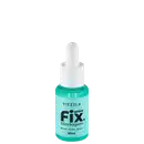 Frasco de vidro com conta-gotas contendo um líquido verde-azulado, com o rótulo "Vizzela Gotas Fix Blindagem" em letras pretas e brancas sobre fundo preto.