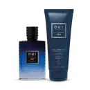 Frascos do perfume e gel de banho O.U.i Le Flâneur 020. Perfume à esquerda, em frasco de vidro azul escuro com detalhes pretos na tampa. O gel de banho, à direita, é embalado em um tubo plástico azul marinho com escrita em prata onde se lê gel douche.