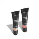 Imagem de duas bisnagas de blush líquido Blush +Glow:, sendo o Rosalix na cor rosa e o Perolali na cor prata. As embalagens são pretas com parte transparente, mostrando a tonalidade do produto e rótulo com letras brancas. O fundo é branco com sombreado.
