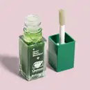 Frasco transparente contendo líquido verde e escova de aplicação em recipiente verde, com rótulo exibindo a frase "Quem disse, Berenice?".