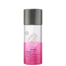 O frasco é cilíndrico, com uma tampa superior cinza e o corpo transparente, metade rosa. O rótulo exibe o nome da marca e do produto, bem como informações sobre o volume do produto, que é de 110 ml.