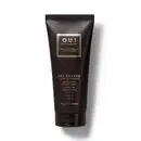 Frasco preto de gel de banho da marca O.U.i, com rótulo dourado em formato retangular contendo informações sobre o produto.