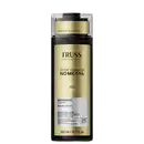 Frasco de shampoo da marca Truss Professional, com rótulo em tons de amarelo e preto, indicando "Stop Damage No Metal" e "Rescue Complex". O produto é apresentado em embalagem plástica transparente com tampa preta.