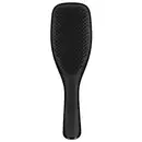 Escova de cabelo preta da marca Tangle Teezer, com design ergonômico e superfície ponteada para facilitar o desembaraço dos fios.
