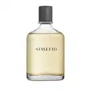 Frasco de fragrância Styletto com tampa preta texturizada e rótulo em letras pretas sobre fundo amarelo claro. O frasco é de vidro transparente, permitindo visualizar o conteúdo líquido.